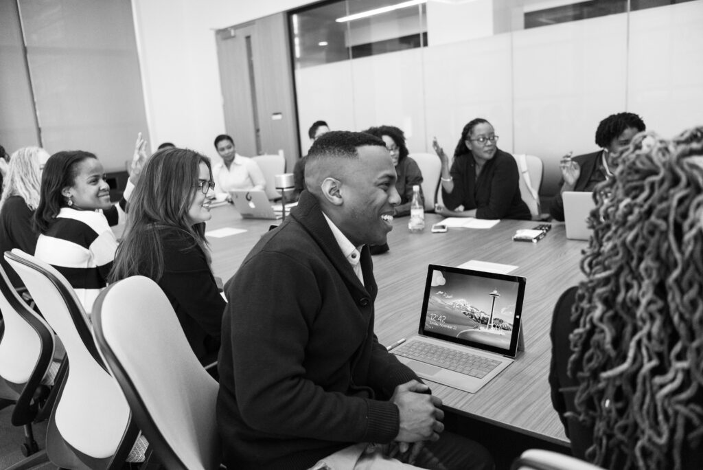 business people in a meeting laughing and working for understanding requirements