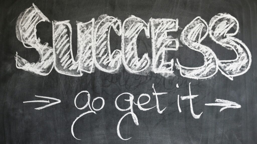 A blackboard with chalk written on it Success go get it illustrating change as an engineer