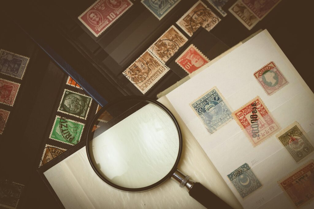 Stamps and a magnifying glass illsustrating elicitation activities in requirements elicitation