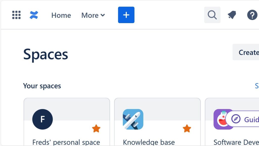 Cropped “Spaces” page header with a top navigation bar and space tiles partially visible below.